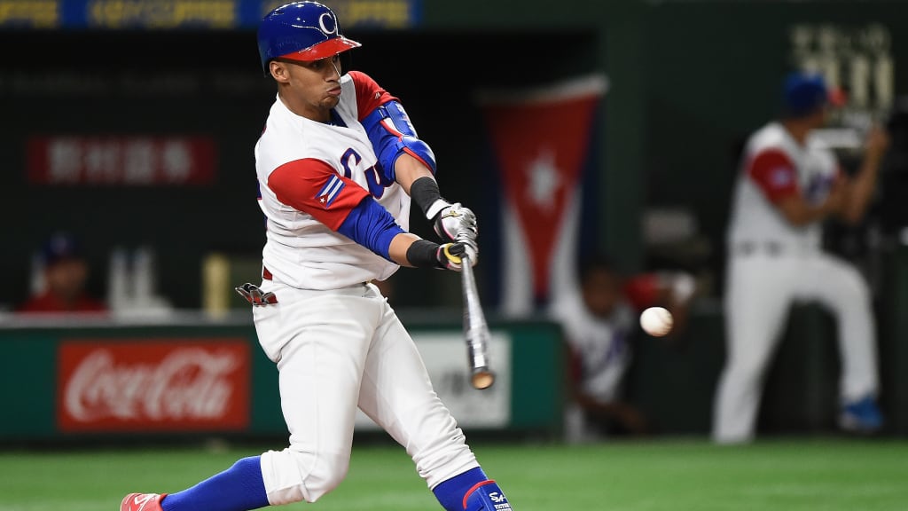 TOKYO, JAPAN - MARCH 15: Outfielder Victor Mesa #32 of Cuba hits a RBI double to make it 13-1 in the bottom of the fifth inning during the World Baseball Classic Pool E Game Five between Netherlands and Cuba at the Tokyo Dome on March 15, 2017 in Tokyo, Japan. (Photo by Matt Roberts/Getty Images)