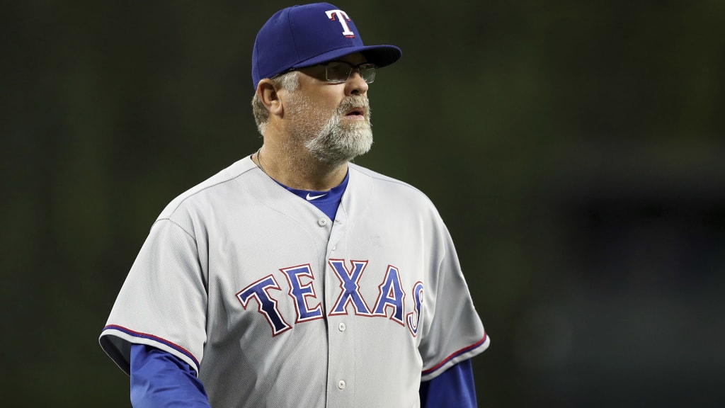 Texas Rangers pitching coach Doug Brocail walks back to the dugout after a mound visit during the ninth inning of a baseball game against the Detroit Tigers, Thursday, July 5, 2018, in Detroit. (AP Photo/Carlos Osorio)