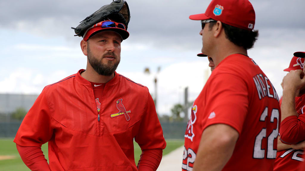 Matt Holliday and Mike Matheny are two of many Cardinals who welcome children's presence in the clubhouse. (AP)