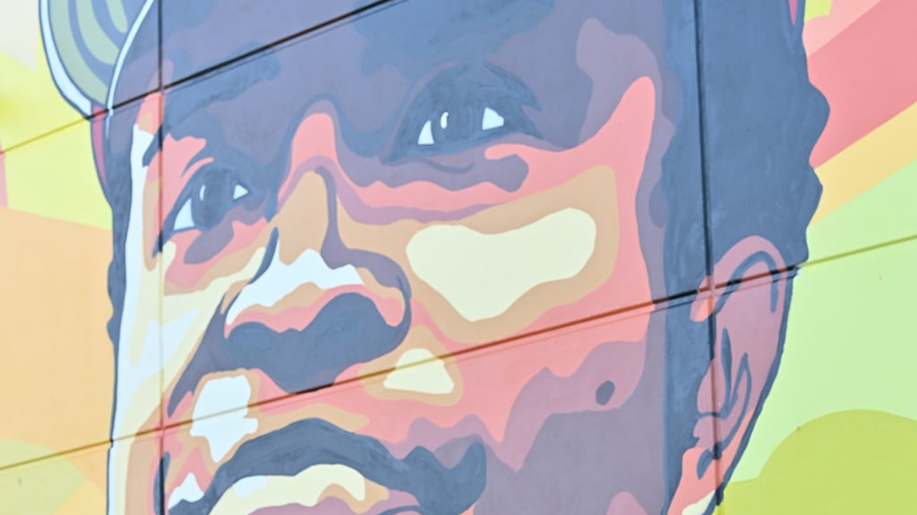 Billingsley speaks at the unveiling of the mural.