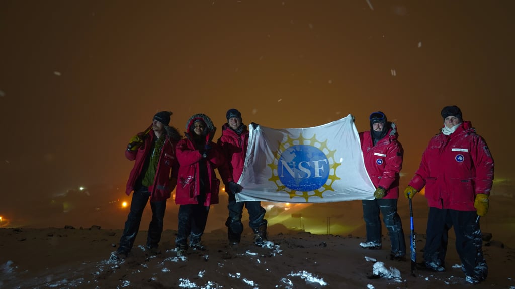 Softball players at the bottom of the globe. (Caleb Terrey via The National Science Foundation)