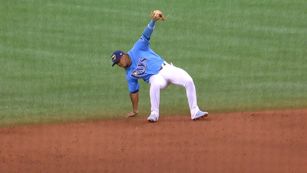 Tampa Bay Rays' Wander Franco sports a tattoo with the date he made his  major league debut as he waits at the on deck circle during the ninth  inning of a baseball