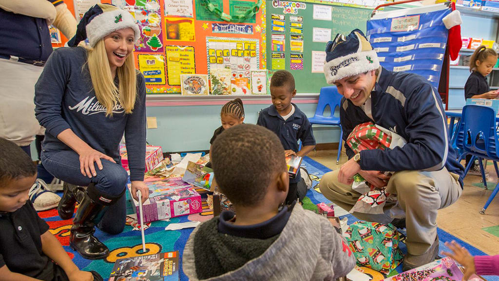 Whitney Ann Lee and David Stearns delivered holiday gifts to kids on Tuesday. (Scott Paulus)