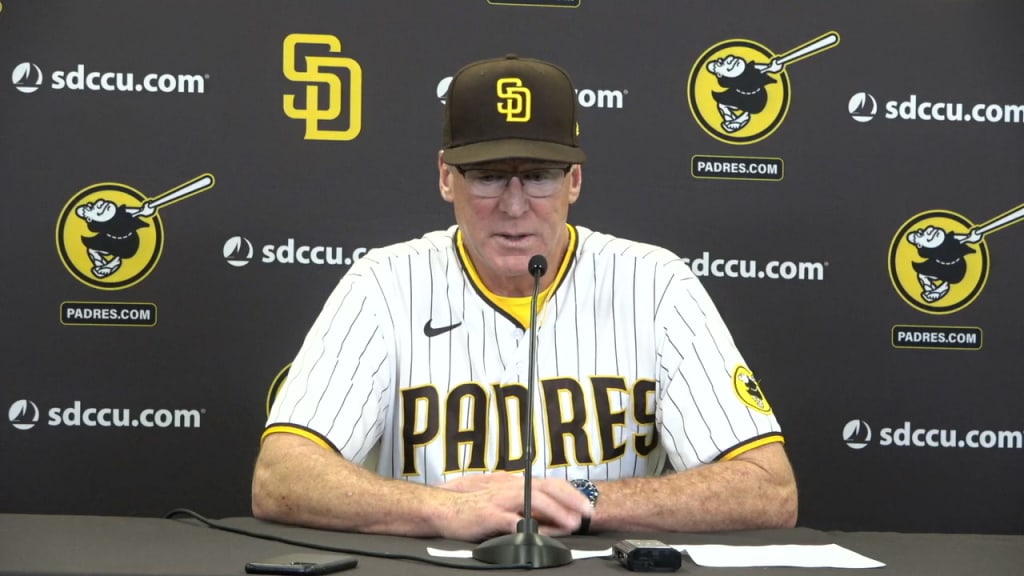 San Diego Padres' Brandon Drury, center, talks with trainers and manager  Bob Melvin (3) after being hit in the helmet by a pitch during the fourth  inning of a baseball game against