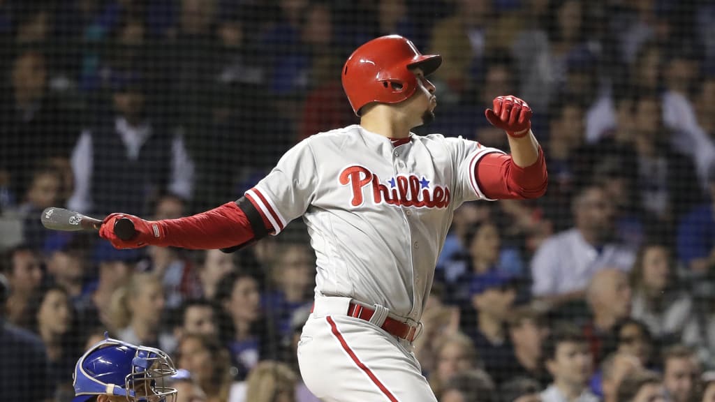 Philadelphia Phillies' Dylan Cozens watches his first career home run, a two-run shot off Chicago Cubs relief pitcher Brandon Morrow, during the ninth inning of a baseball game Wednesday, June 6, 2018, in Chicago. (AP Photo/Charles Rex Arbogast)