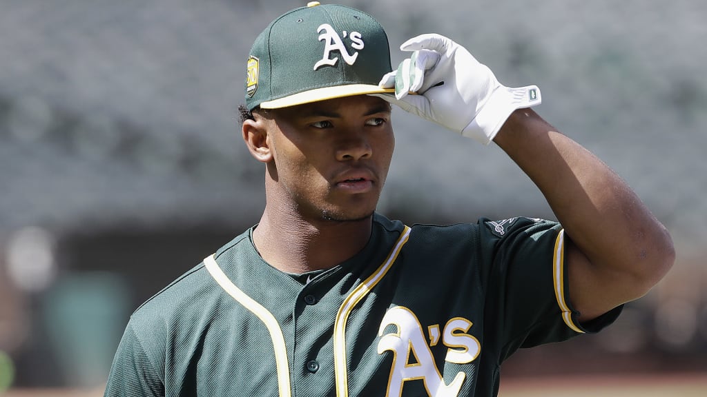 FILE - In this June 15, 2018, file photo, Oakland Athletics draft pick Kyler Murray looks on before a baseball game between the Athletics and the Los Angeles Angels in Oakland, Calif. Representatives of the Athletics and Major League Baseball met Sunday, Jan. 13, 2019, with Heisman Trophy winner Murray, a day before the Oklahoma quarterbackâs deadline to enter the NFL draft, a person with direct knowledge of the session said. (AP Photo/Jeff Chiu, File)