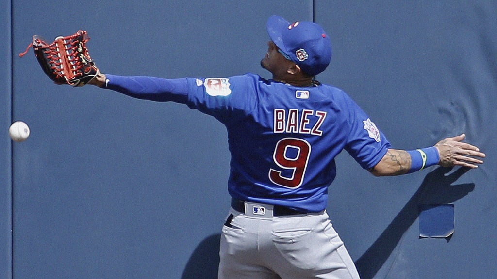 Chicago Cub Javier Baez is all smiles making no-look tag for