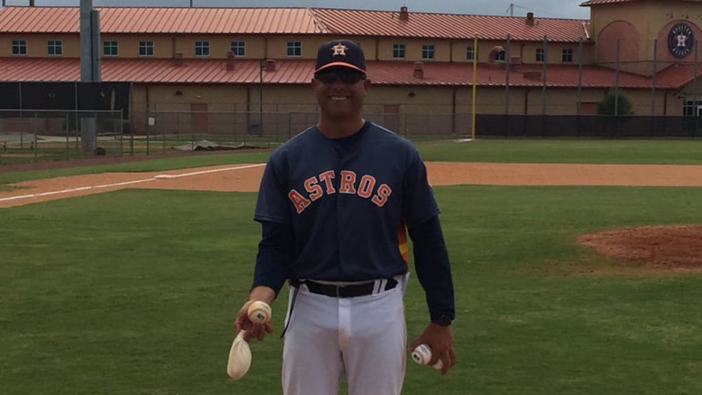 Astros Minor League pitching coach Josh Miller held the final pitched ball at Osceola County Stadium. (Mike Elias)