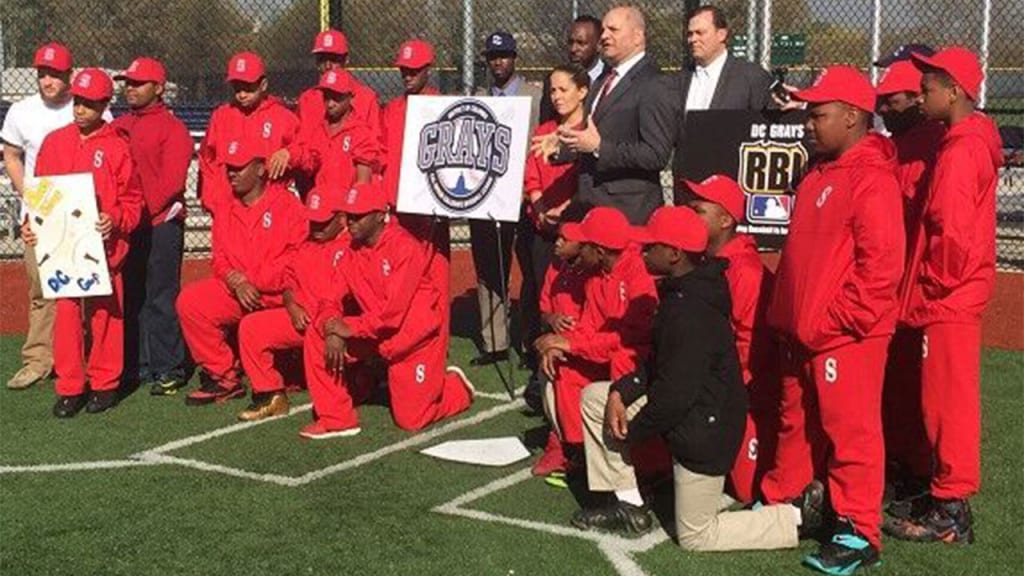 D.C. Grays president and founder Michael Barbera announces the D.C. Grays RBI program and the gift of apparel to the John Philip Sousa Middle School baseball program. (D.C. Grays)