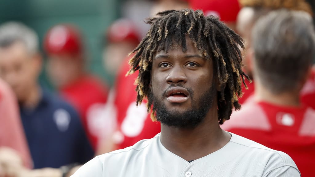 Philadelphia Phillies' Odubel Herrera celebrates in the dugout after hitting a two-run home run off Cincinnati Reds starting pitcher Anthony DeSclafani in the second inning of a baseball game, Friday, July 27, 2018, in Cincinnati. (AP Photo/John Minchillo)