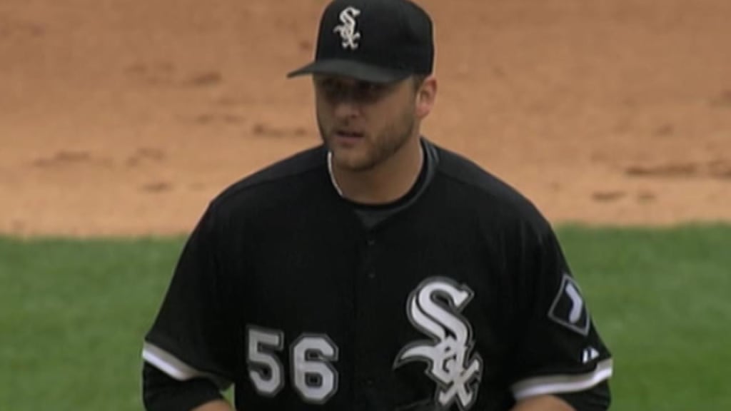 Chicago White Sox starting pitcher Mark Buehrle adjusts his cap