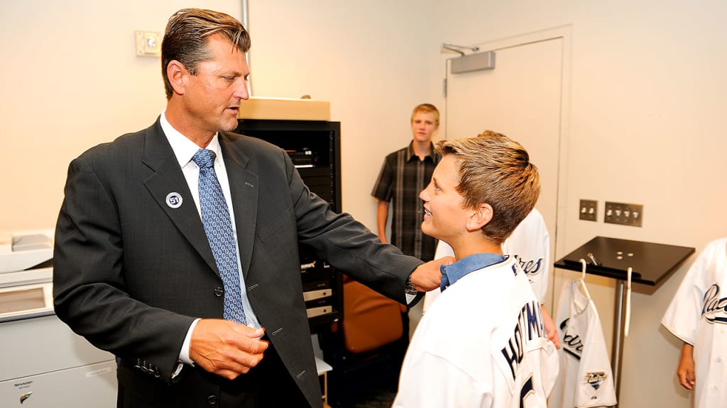 Quinn Hoffman with his dad, Trevor, during Trevor's number retirement ceremony in 2011. (Andy Hayt)