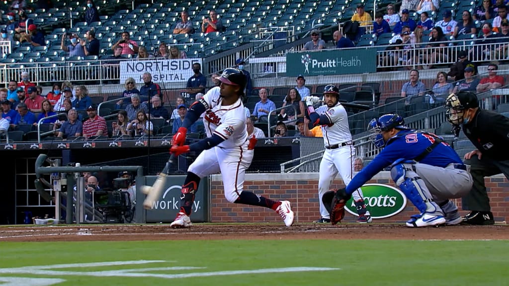 Ozzie Albies of the Atlanta Braves laughs in the dugout during the