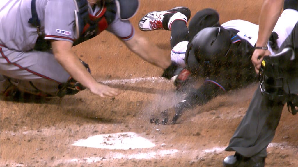 Marlins' Garrett Cooper reacts to his game-winning grand slam to sweep  Tigers 