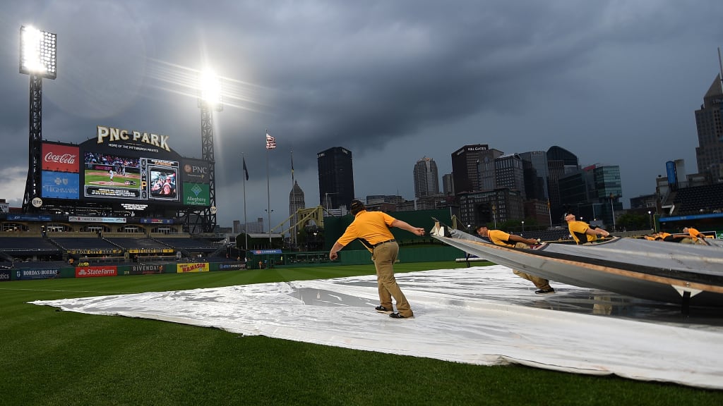 PITTSBURGH, PA - JUNE 20: The PNC Park grounds crew removes the tarp from the field during a rain delay in the game between the Pittsburgh Pirates and the Milwaukee Brewers at PNC Park on June 20, 2018 in Pittsburgh, Pennsylvania. (Photo by Justin Berl/Getty Images)