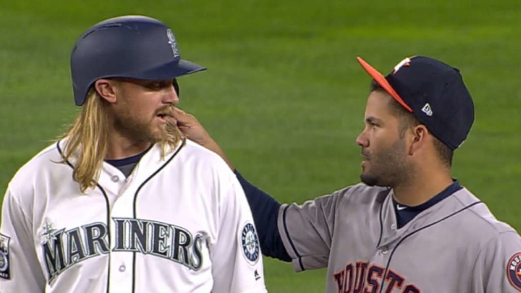 Jose Altuve couldn't resist the appeal of Taylor Motter's long blond locks  and just had to get a feel