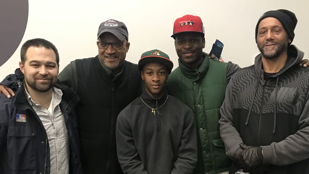 Husband’s son, Darryl II (center), with MJBL executive director William Forrester Jr. (far right) and MLB/RBI team members Bennett Shields, David James and Kindu Jones (from left to right).