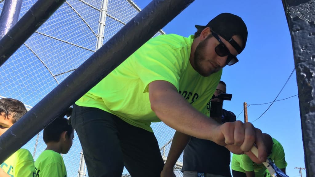 Potential starter Brandon Maurer helped paint grandstands at a youth baseball field. (Padres)