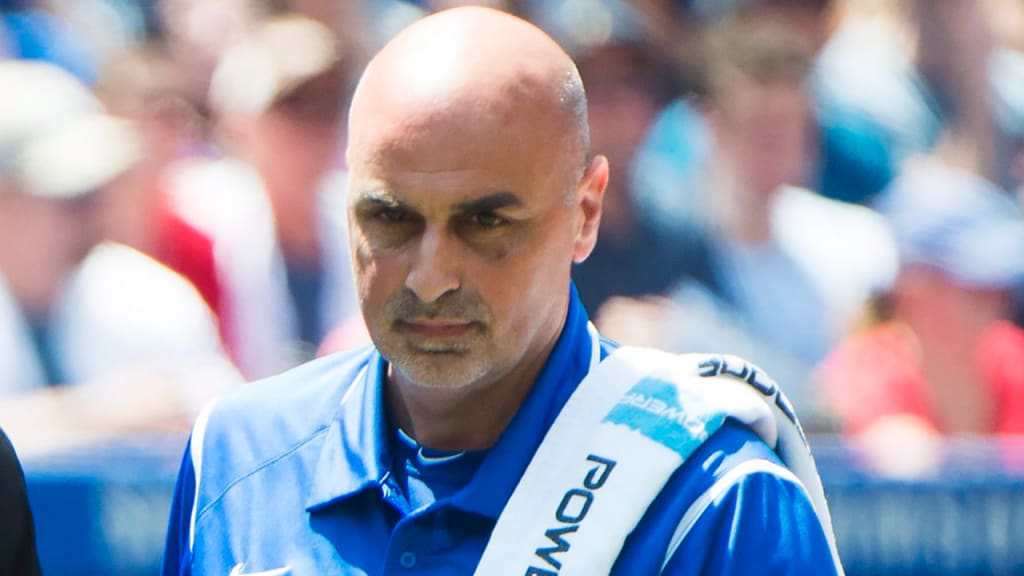 George Poulis spent the past 15 seasons as the head athletic trainer for the Blue Jays. (AP)