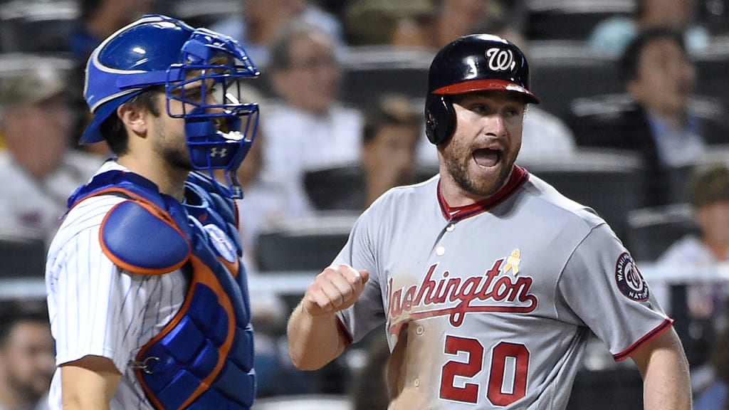 Daniel Murphy scores on Anthony Rendon's two-run single in the ninth on Friday night. (AP)
