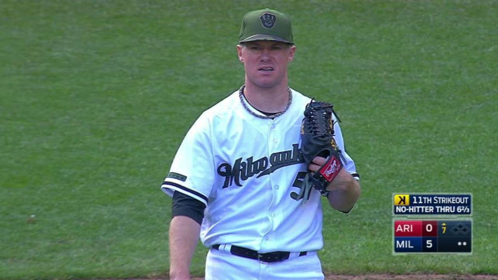 Catcher Jett Bandy of the Milwaukee Brewers sets to throw to first