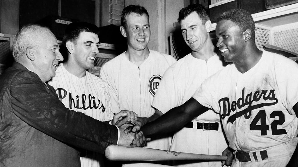 NL president Warren Giles (left) congratulates Curt Simmons, Bob Rush, Hank Sauer and Jackie Robinson. (AP)