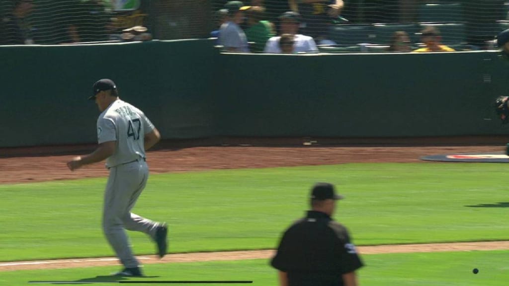 Seattle Mariners' Dee Strange-Gordon adjusts his batting helmet