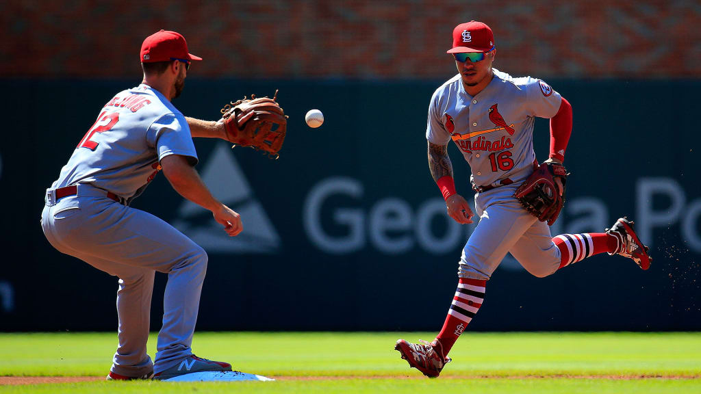 Kolten Wong tosses a ground ball to Paul DeJong for an out during the first inning against the Braves at SunTrust Park on Sept. 19, 2018.
