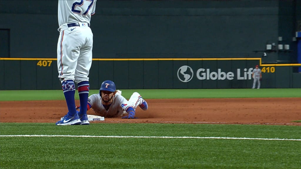 Texas Rangers shortstop Elvis Andrus (1) leaps over Houston Astros