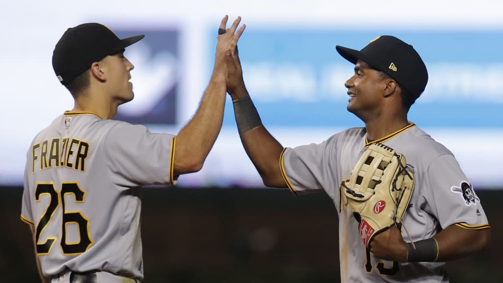Pittsburgh Pirates' Adam Frazier, left, and Pablo Reyes celebrate the team's 6-0 win against the Chicago Cubs in a baseball game Tuesday, Sept. 25, 2018, in Chicago. (AP Photo/Jim Young)