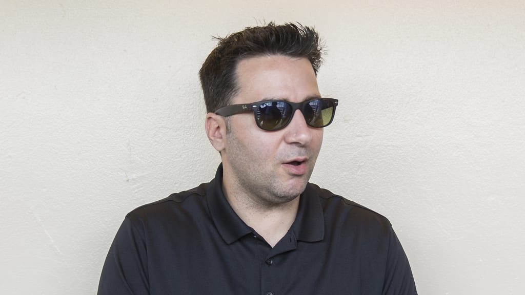 Atlanta Braves general manager Alex Anthopoulos talks to media representatives during baseball spring training camp in Kissimmee, Fla., Wednesday, Feb. 14, 2018. (AP Photo/Willie J. Allen Jr.)