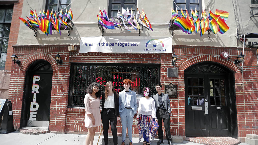 The first class of five Yankees-Stonewall Scholars in front of the landmark bar where the LGBTQ rights movement exploded into being on June 28, 1969.