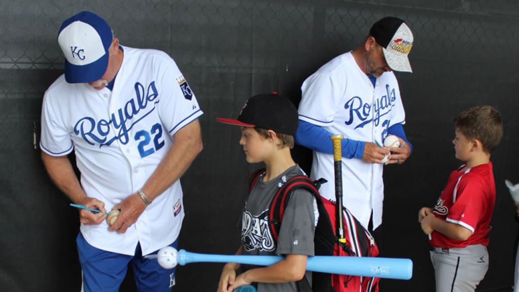 Dennis Leonard and Les Norman sign autographs for kids at Play Ball event in Lenexa, Kansas.