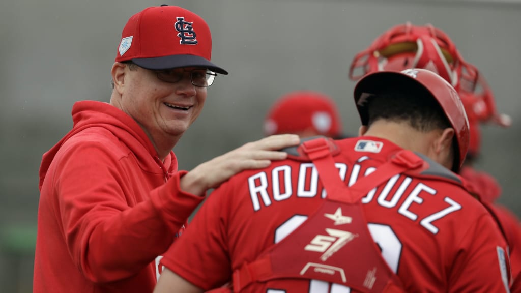 St. Louis Cardinals manager Mike Shildt, left, talks with catcher Julio Rodriguez during spring training baseball practice Wednesday, Feb. 13, 2019, in Jupiter, Fla. (AP Photo/Jeff Roberson)