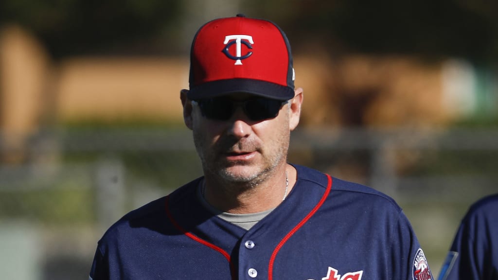 Minnesota Twins bench coach Derek Shelton walks the field before practice during baseball spring training, Saturday, Feb. 17, 2018, in Fort Myers, Fla. (AP Photo/John Minchillo)