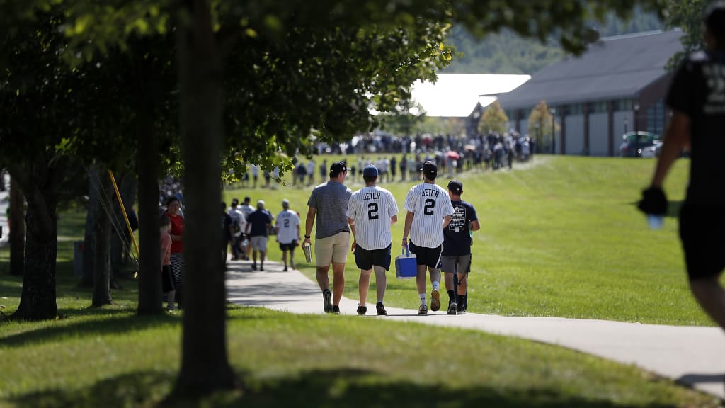 After more than a year of delay, the ominous weather forecast held out, and fans happily walked the mile from Main Street to the ceremony at the Clark Sports Center. The original plan -- for Jeter to accept his baseball immortality in a private event -- mercifully gave way to an almost-normal induction weekend. (Credit: New York Yankees)