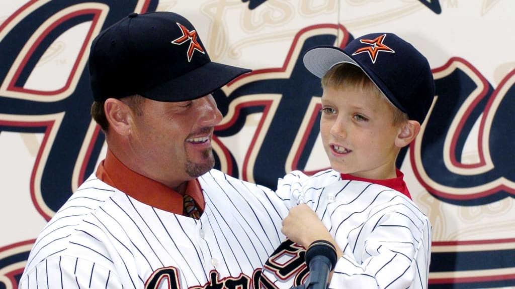 Kody Clemens at age 7 with his dad Roger.