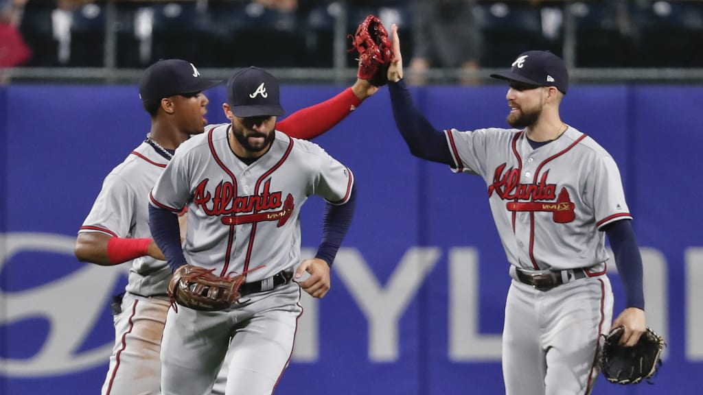 Atlanta Braves right fielder Nick Markakis, right, center fielder Ender Inciarte, center, and left fielder Ronald Acuna Jr., left, celebrates after defeating the Pittsburgh Pirates in a baseball game, Monday, Aug. 20, 2018, in Pittsburgh. The Braves won 1-0. (AP Photo/Keith Srakocic)