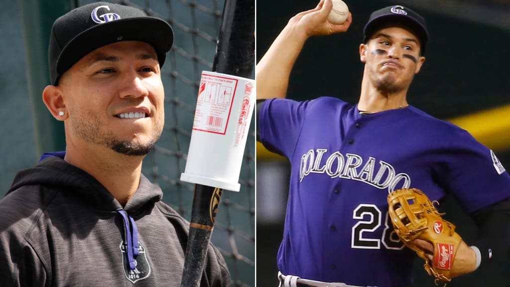 Rockies' Carlos Gonzalez and Nolan Arenado received Silver Slugger Awards before Friday's home opener. (AP)