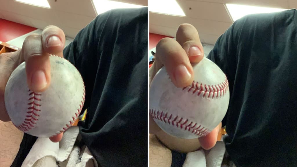 Romero shows off his old slider grip (left) vs. his new slider grip (right). (Photo credits Chris Ware/Phillies)