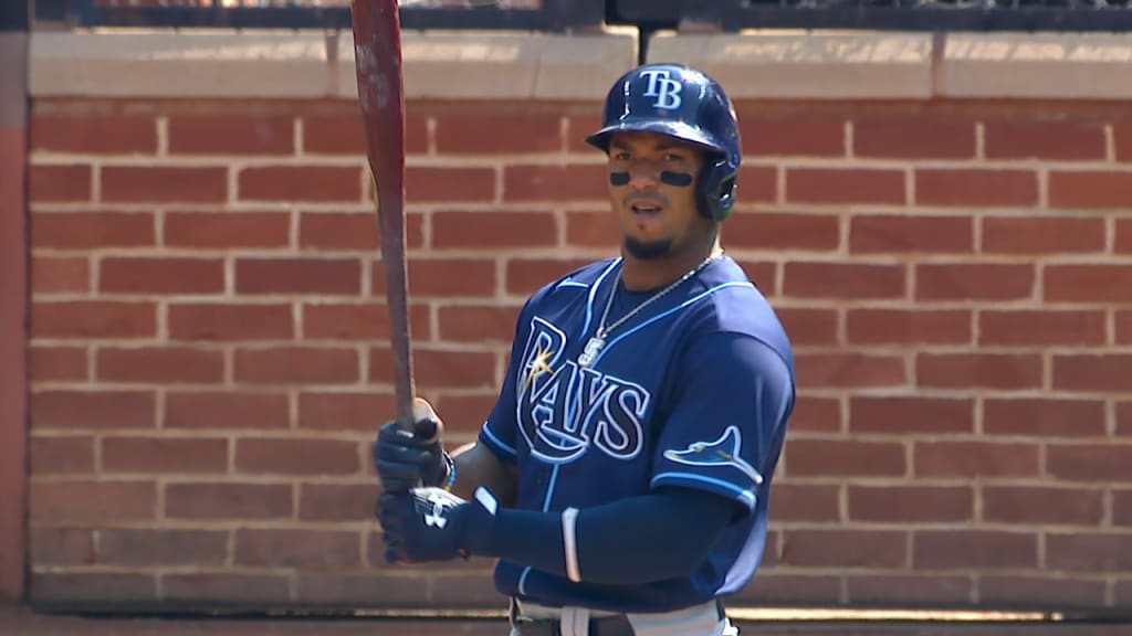 Tampa Bay Rays' Wander Franco sports a tattoo with the date he made his  major league debut as he waits at the on deck circle during the ninth  inning of a baseball