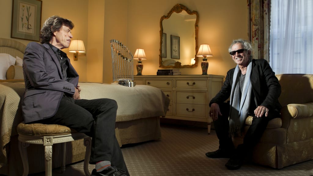 The Rolling Stones’ Mick Jagger and Keith Richards with the 2009 World Series trophy