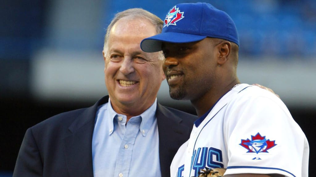 Pat Gillick, then GM of the Mariners and seen with Carlos Delgado, is honoured prior to an August 2002 game in Toronto.