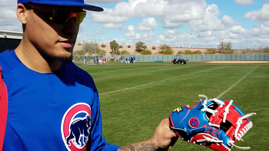 Javier Baez shows off his new glove he'll use for the World Baseball Classic. (Carrie Muskat/MLB)