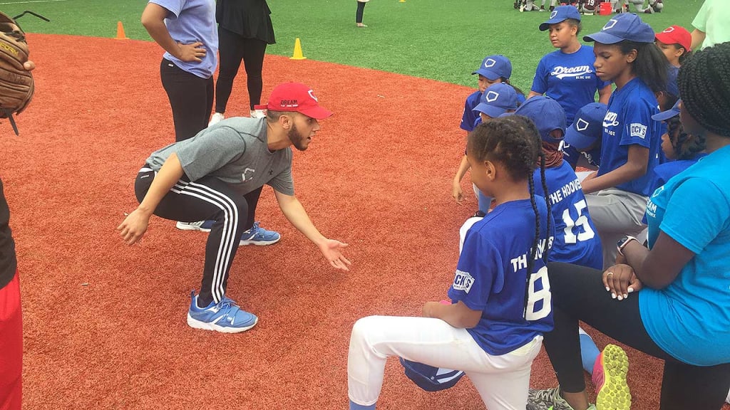 A DREAM youth clinic instructor shares advice Thursday at Patterson Playground. (Matthew Martell)