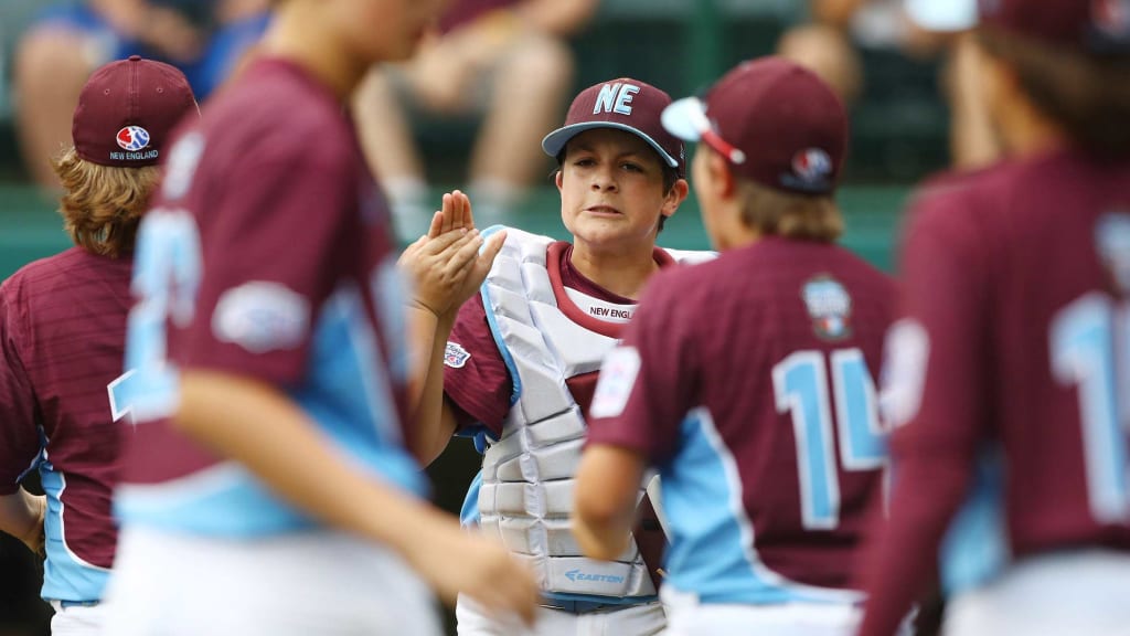 Catcher Aidan Rivera of the New England team from Connecticut celebrates with teammates after winning Game 2 of the 2017 Little League World Series, 7-6, against the Mid-Atlantic team from New Jersey in South Williamsport, Pa. (Alex Trautwig/MLB Photos/Getty)