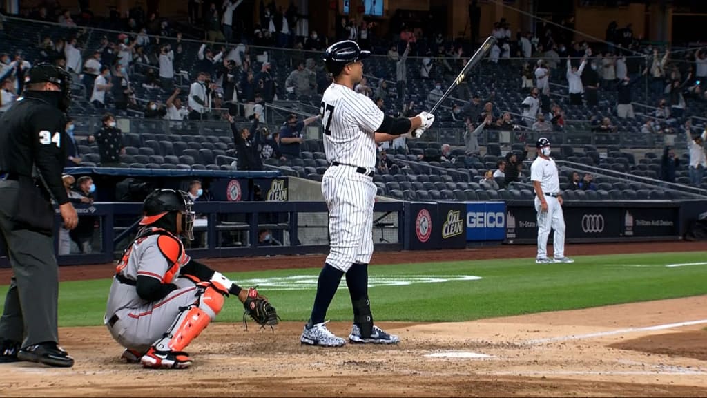 Miami Marlins center fielder Giancarlo Stanton returns to the dugout after  the second inning against the New York Yankees in their first exhibition  game at the new Marlins Ball Park April 1