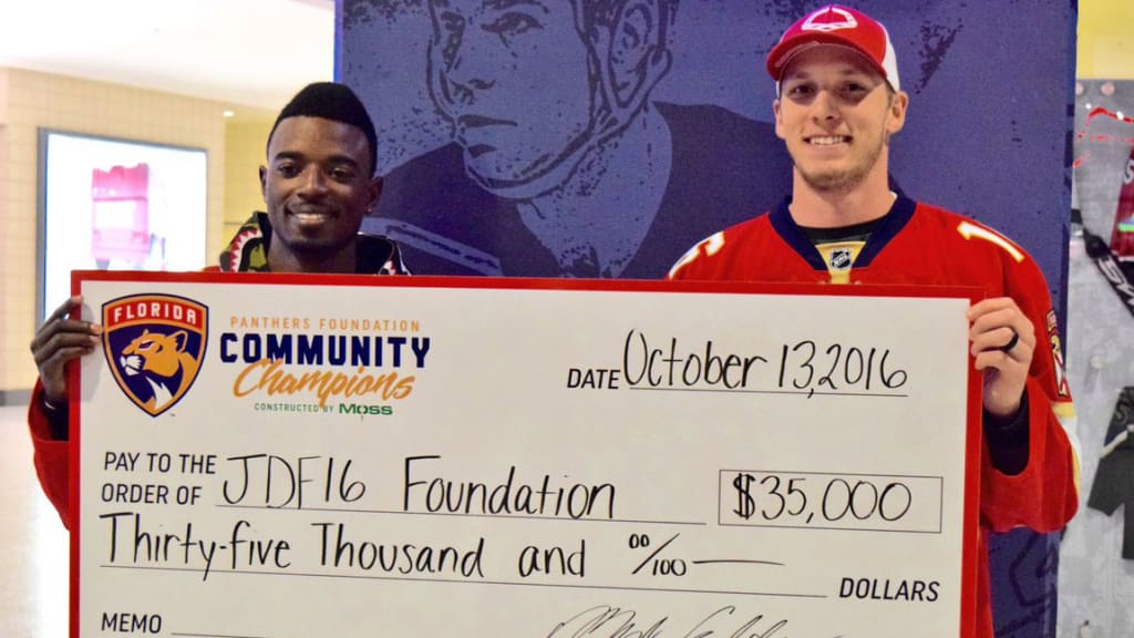 Dee Gordon and Adam Conley accepted a donation of $35,000 by the Panthers to the JDF16 Foundation, established to assist Jose Fernandez's family. (@Marlins)