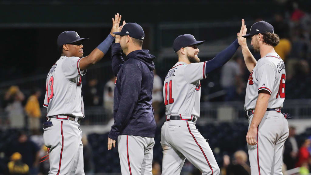 Atlanta Braves' Ender Inciarte (11) celebrates with teammates after they defeated the Pittsburgh Pirates 2-1 in a baseball game Wednesday, Aug. 22, 2018, in Pittsburgh. (AP Photo/Keith Srakocic)