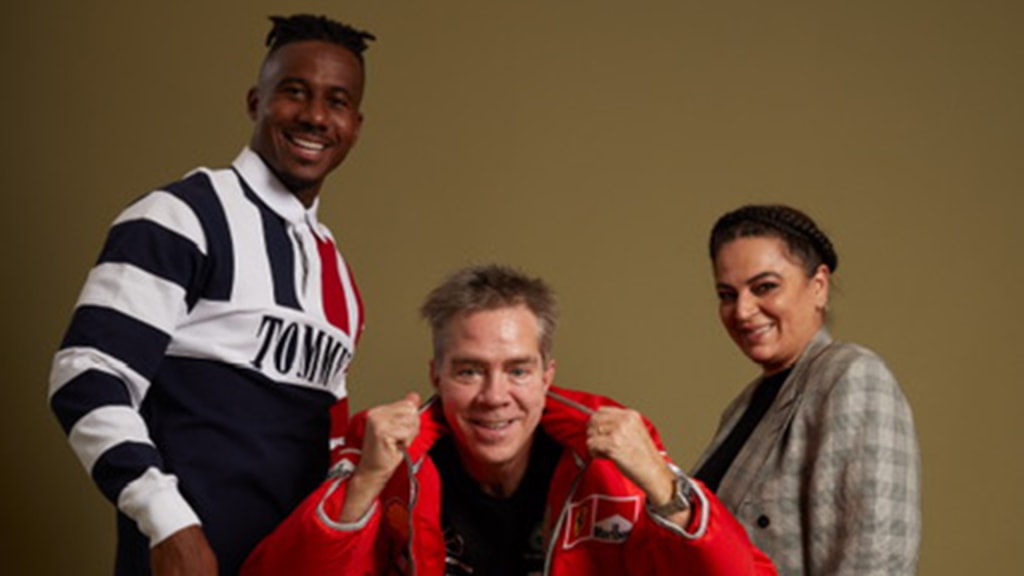 Lewis Brinson in Tommy Jeans red white and blue Snoop rugby shirt, with designer Andy Hilfiger and stylist Sandra Madjdi.